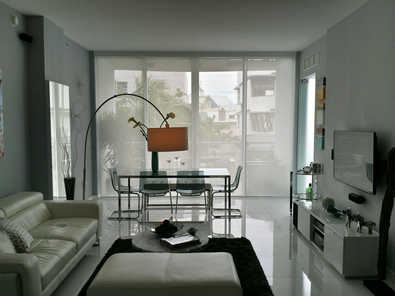 Our project: a living room with solar screen roller shades
